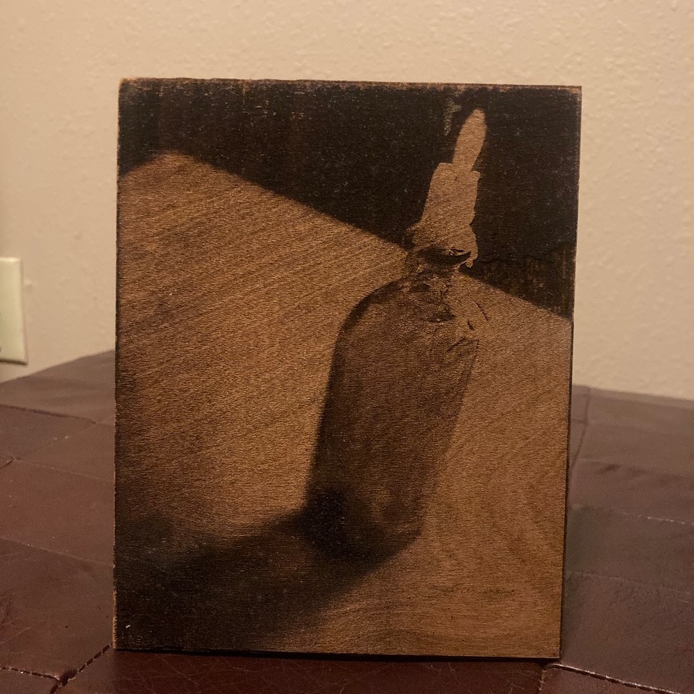 candle image burned into wood